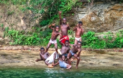 A group of local afro-ecuadorian boys poses while out swimming on the Wimbi River, northwest Ecuador.