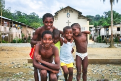 A group of local afro-ecuadorian boys poses in the town of Playa de Oro, Ecuador.
